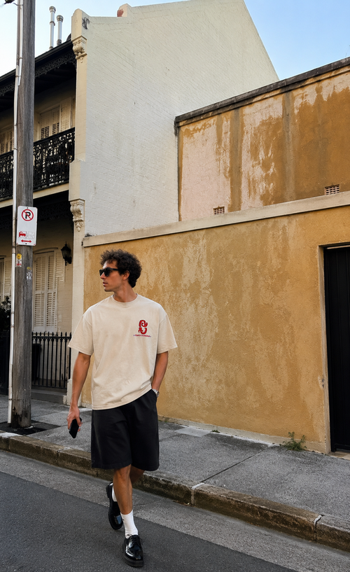 Cream white oversized t-shirt with graphic "life" logo